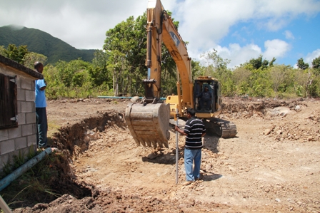 Public Works Department Staff oversee excavation work at Spring Hill ahead of construction of a 500,000 water storage reservoir. It will be one of four new reservoirs to be constructed under the Caribbean Development Bank funded Water Enhancement Project on Nevis